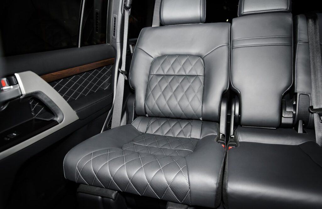 Black perforated leather back seats in modern luxury car