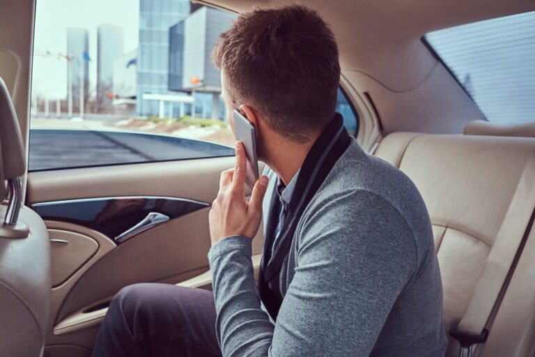 A handsome businessman in luxury car